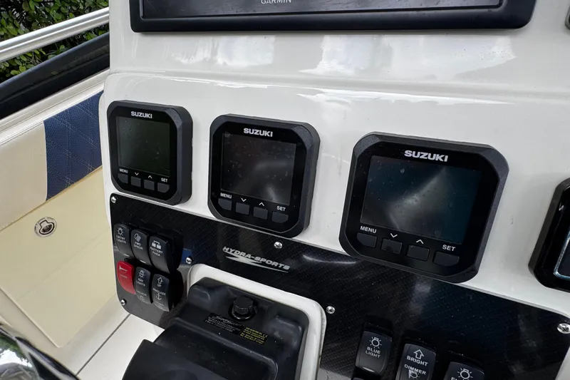  Yacht Photos Pics Control panel of a 2007 Hydra-Sports Vector 3300 VX boat with Suzuki displays.