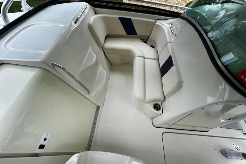  Yacht Photos Pics 2007 Hydra-Sports Vector 3300 VX boat interior with white seating and storage compartments.