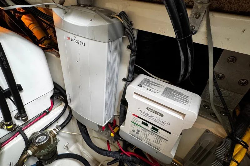  Yacht Photos Pics 2007 Hydra-Sports Vector 3300 VX engine compartment with ProNautic 12-30P charger and Freedom HF inverter.