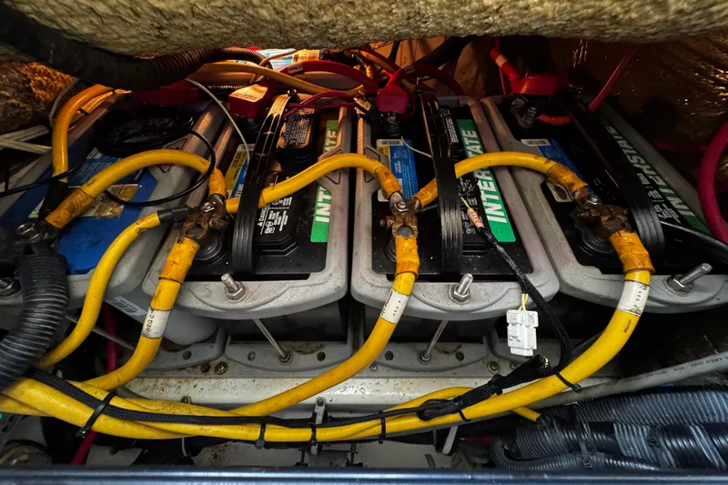  Yacht Photos Pics Battery compartment of a 2007 Hydra-Sports Vector 3300 VX with yellow cables.