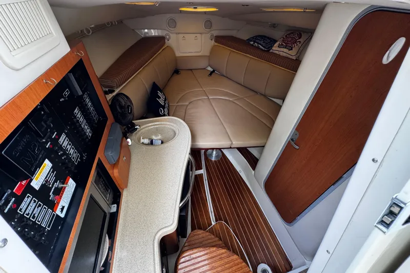  Yacht Photos Pics 2007 Hydra-Sports Vector 3300 VX cabin interior with seating and control panel.