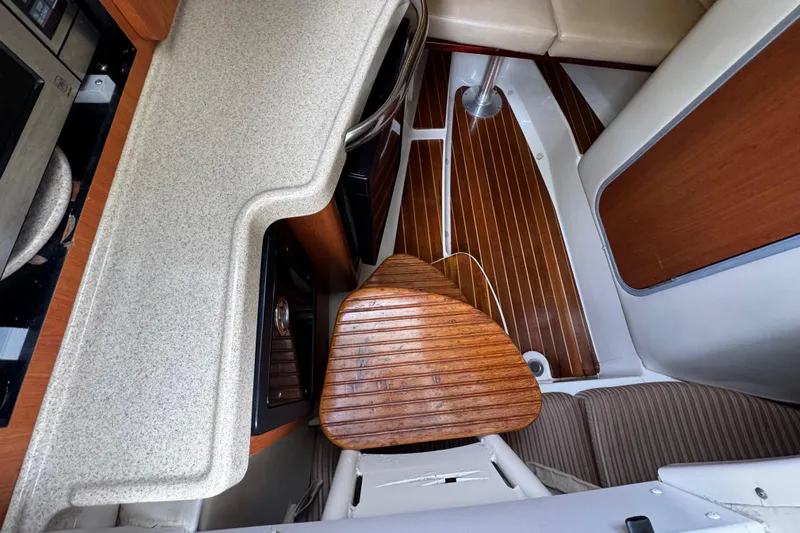  Yacht Photos Pics 2007 Hydra-Sports Vector 3300 VX cabin interior with wood flooring and seating.