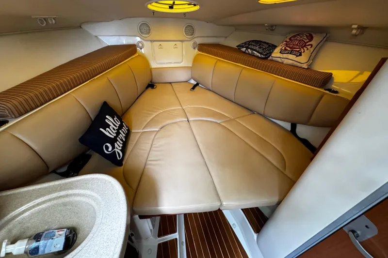  Yacht Photos Pics 2007 Hydra-Sports Vector 3300 VX cabin with beige seating and decorative pillows.