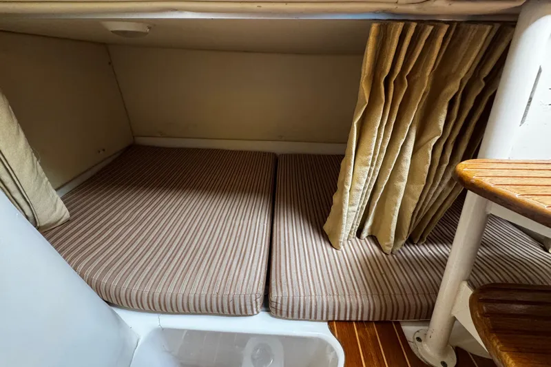  Yacht Photos Pics 2007 Hydra-Sports Vector 3300 VX cabin with striped cushions and wooden steps.