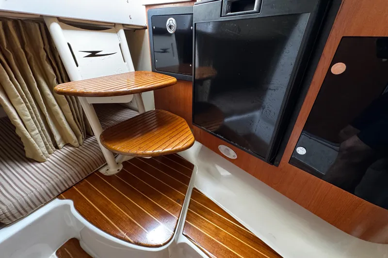  Yacht Photos Pics 2007 Hydra-Sports Vector 3300 VX cabin interior with wooden steps and cabinetry.