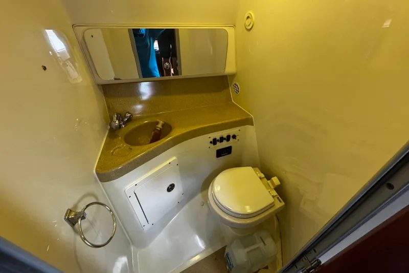  Yacht Photos Pics 2007 Hydra-Sports Vector 3300 VX boat bathroom with sink, mirror, and toilet.