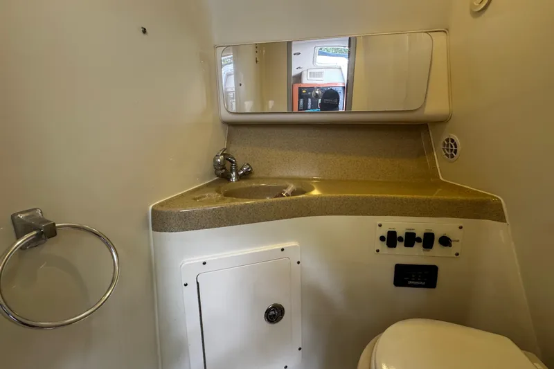  Yacht Photos Pics 2007 Hydra-Sports Vector 3300 VX bathroom with sink, mirror, and control panel.