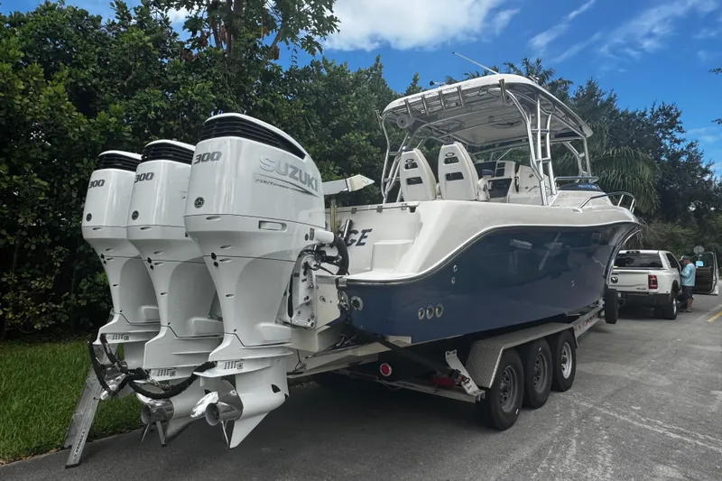  Yacht Photos Pics 2007 Hydra-Sports Vector 3300 VX boat with triple Suzuki 300 engines on trailer.