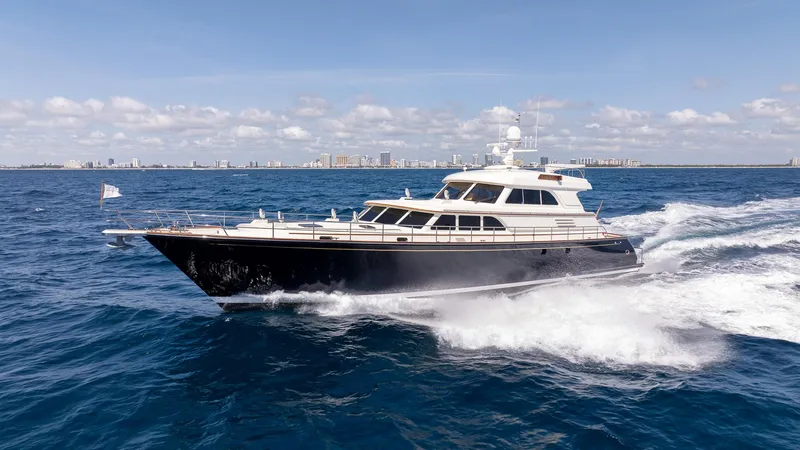 Liberty Yacht Photos Pics 2004 Lyman-Morse Motoryacht cruising on open sea under clear skies.