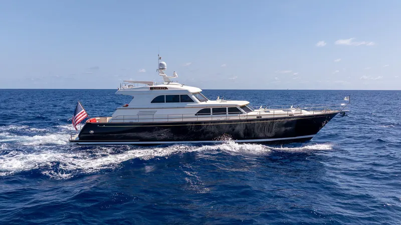 Liberty Yacht Photos Pics 2004 Lyman-Morse Motoryacht cruising on open ocean under clear skies.