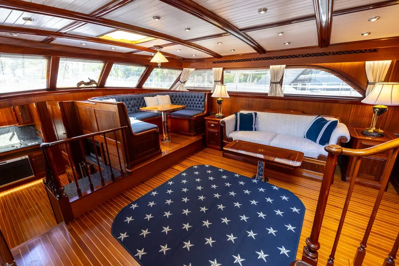 Liberty Yacht Photos Pics Luxurious 2004 Lyman-Morse motoryacht interior with elegant wood finish and plush seating.