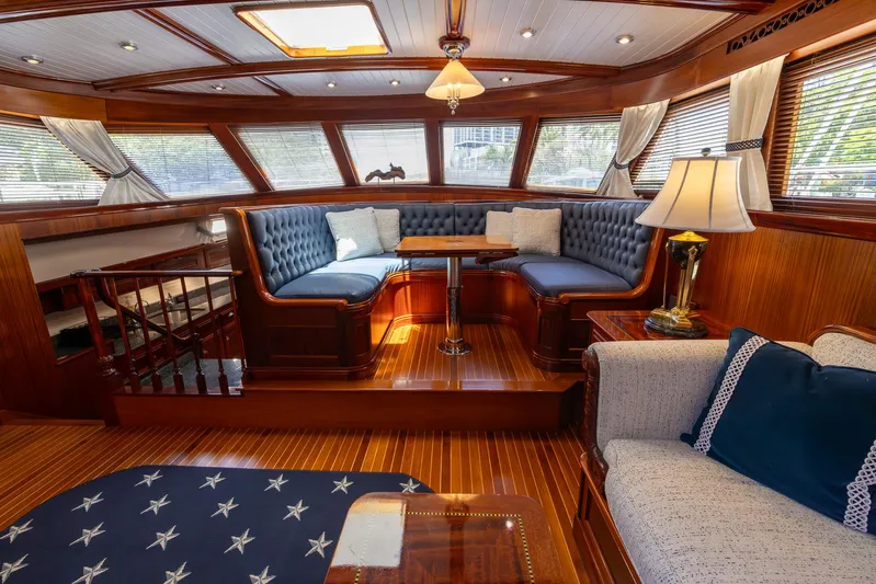 Liberty Yacht Photos Pics Luxurious 2004 Lyman-Morse Motoryacht interior with elegant wood finishes and plush seating.