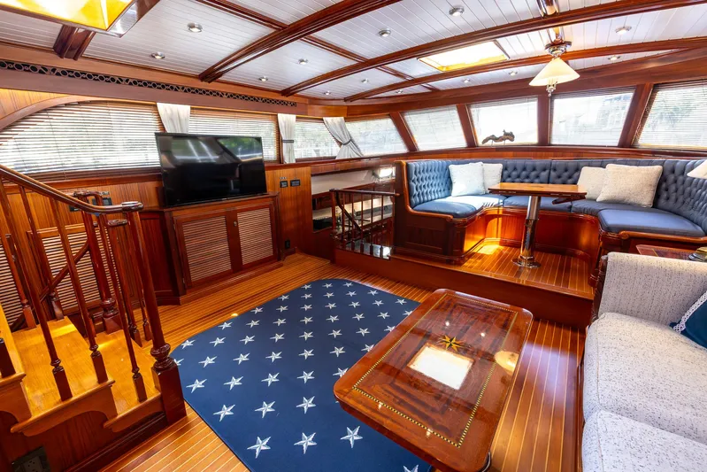 Liberty Yacht Photos Pics Luxurious 2004 Lyman-Morse Motoryacht interior with elegant wood finishes and plush seating.