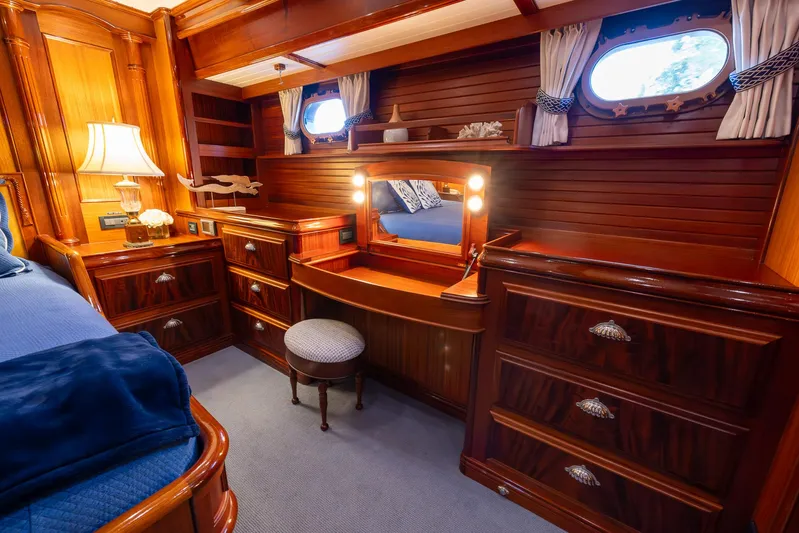 Liberty Yacht Photos Pics Luxurious wooden interior of 2004 Lyman-Morse Motoryacht with vanity and drawers.