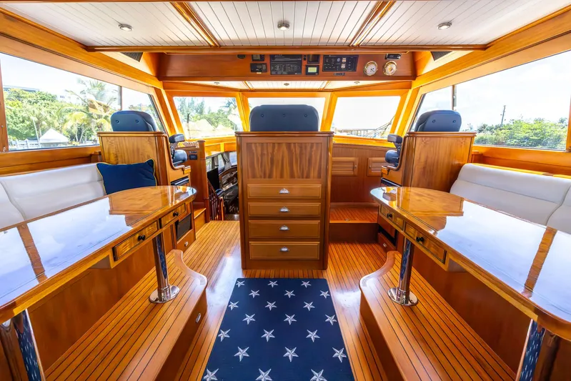 Liberty Yacht Photos Pics Luxurious 2004 Lyman-Morse Motoryacht interior with polished wood and elegant seating.