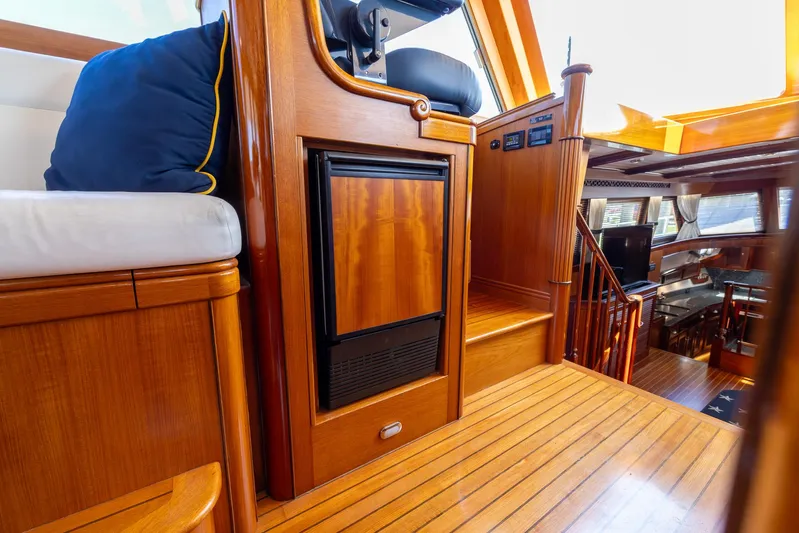 Liberty Yacht Photos Pics Luxurious 2004 Lyman-Morse Motoryacht interior with elegant wood finish and comfortable seating.