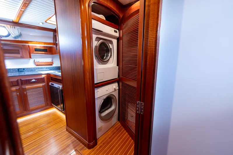 Liberty Yacht Photos Pics Stacked washer and dryer in 2004 Lyman-Morse Motoryacht's wooden interior.