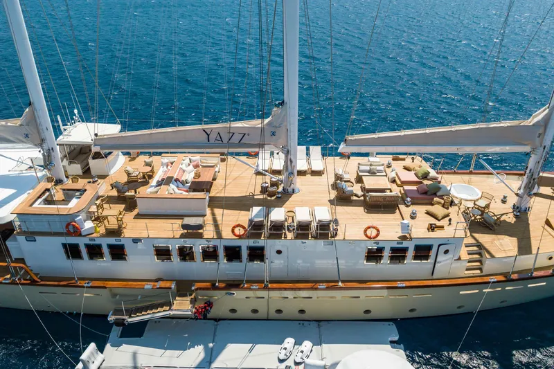 Yazz Yacht Photos Pics Luxurious 2007 Aegean Yacht with spacious deck and elegant seating, sailing on blue ocean waters.