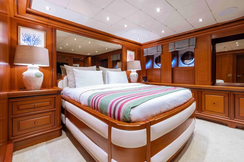 Yazz Yacht Photos Pics Luxurious 2007 Aegean Yacht bedroom with elegant wood paneling and cozy bedding.