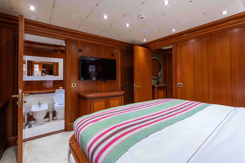 Yazz Yacht Photos Pics Luxurious 2007 Aegean Yacht bedroom with ensuite bathroom, wooden interior, and modern amenities.