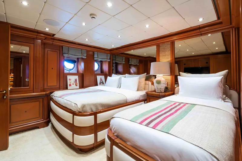 Yazz Yacht Photos Pics Luxurious 2007 Aegean Yacht bedroom with twin beds and elegant wood paneling.