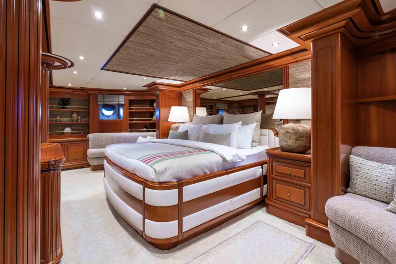 Yazz Yacht Photos Pics Luxurious 2007 Aegean Yacht bedroom with elegant wood furnishings and plush bedding.