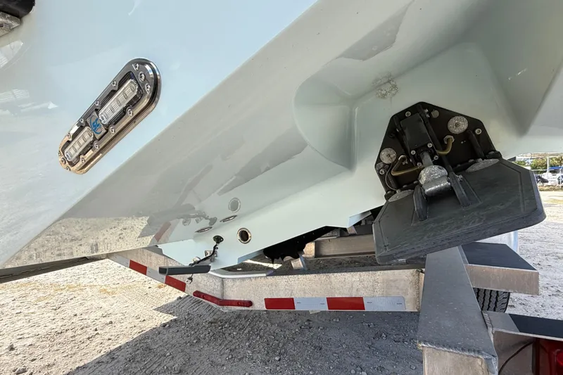  Yacht Photos Pics 2018 Yellowfin 32 Offshore boat on trailer, showing hull and trim tab details.