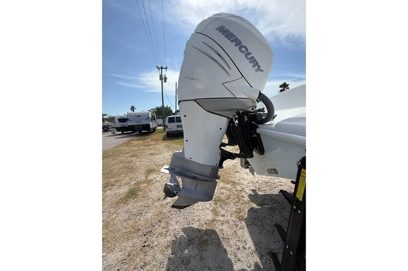  Yacht Photos Pics 2018 Yellowfin 32 Offshore with Mercury outboard motor in a sunny outdoor setting.