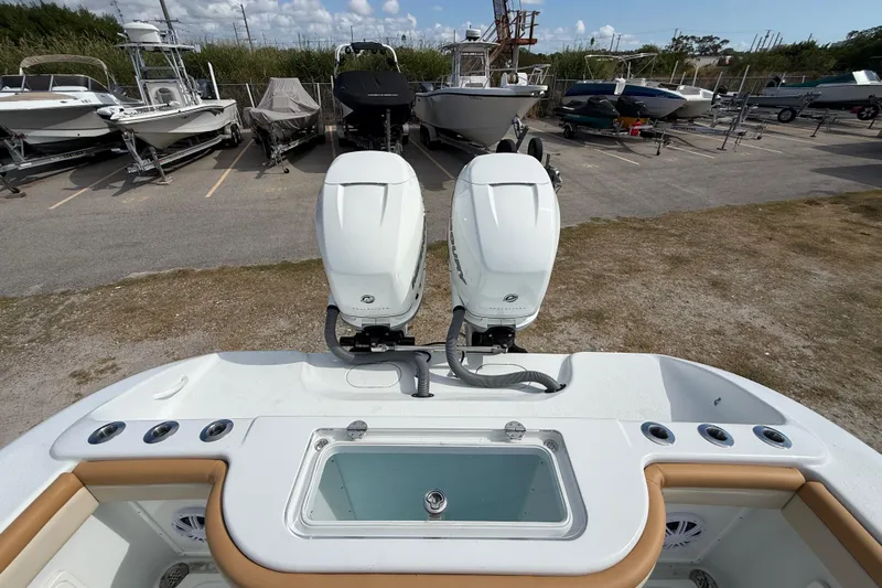  Yacht Photos Pics 2018 Yellowfin 32 Offshore boat with dual outboard motors in a marina.