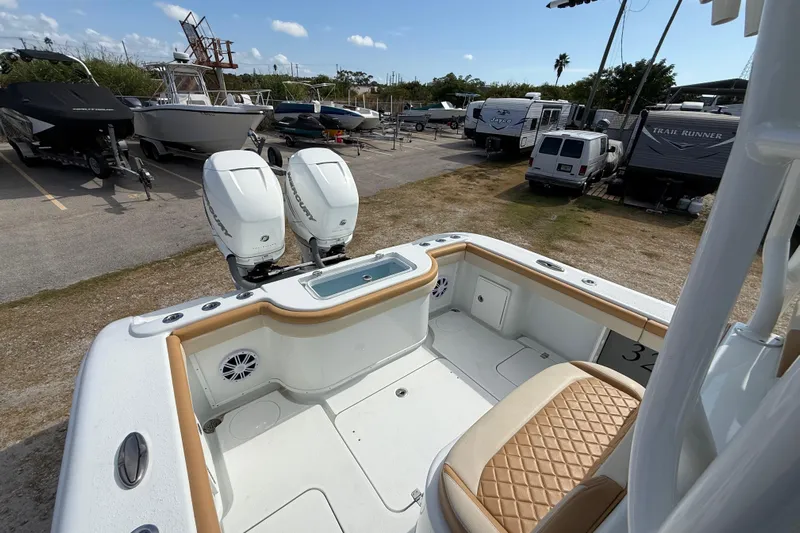  Yacht Photos Pics 2018 Yellowfin 32 Offshore boat with dual Mercury engines in a marina setting.