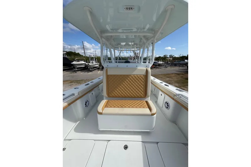  Yacht Photos Pics 2018 Yellowfin 32 Offshore boat interior with tan quilted seating and spacious deck.