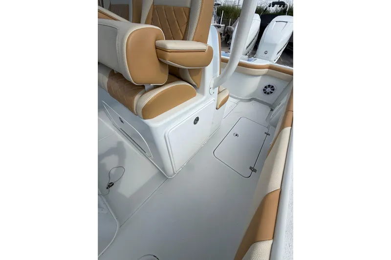  Yacht Photos Pics 2018 Yellowfin 32 Offshore boat interior with tan and white seating.