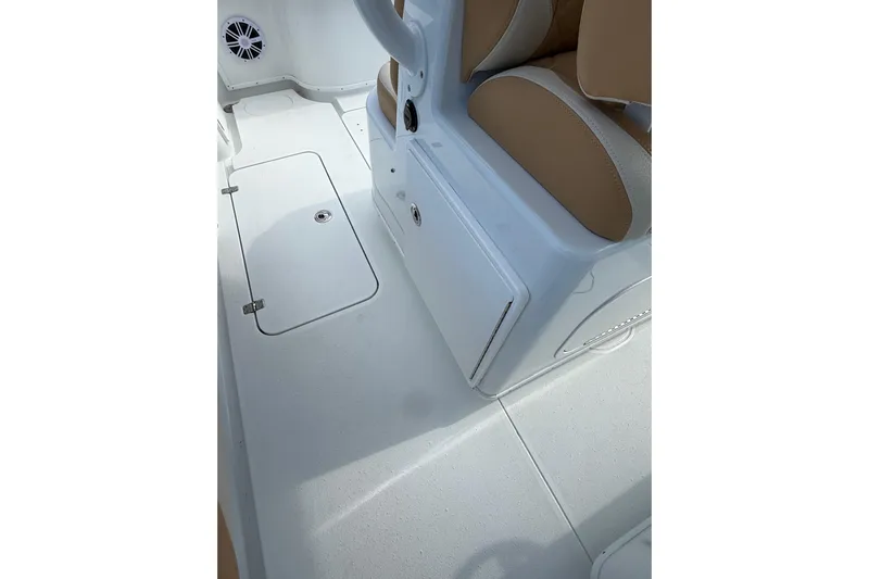  Yacht Photos Pics 2018 Yellowfin 32 Offshore boat interior with white deck and tan seating.