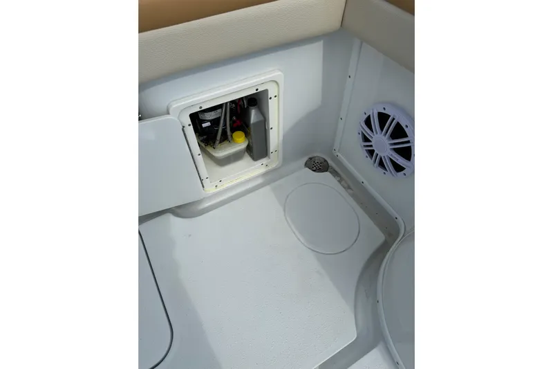  Yacht Photos Pics 2018 Yellowfin 32 Offshore boat interior with storage compartment and speaker.