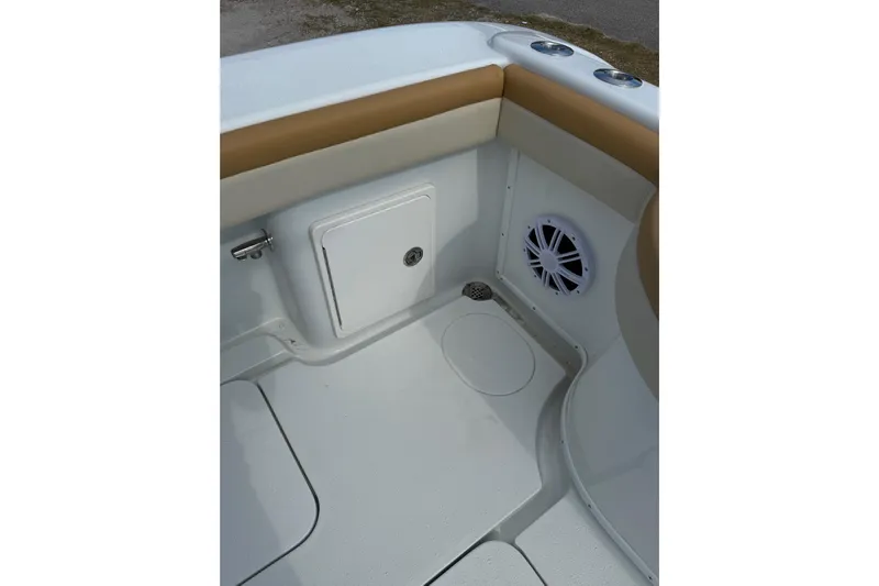  Yacht Photos Pics 2018 Yellowfin 32 Offshore boat interior with storage compartment and speaker.