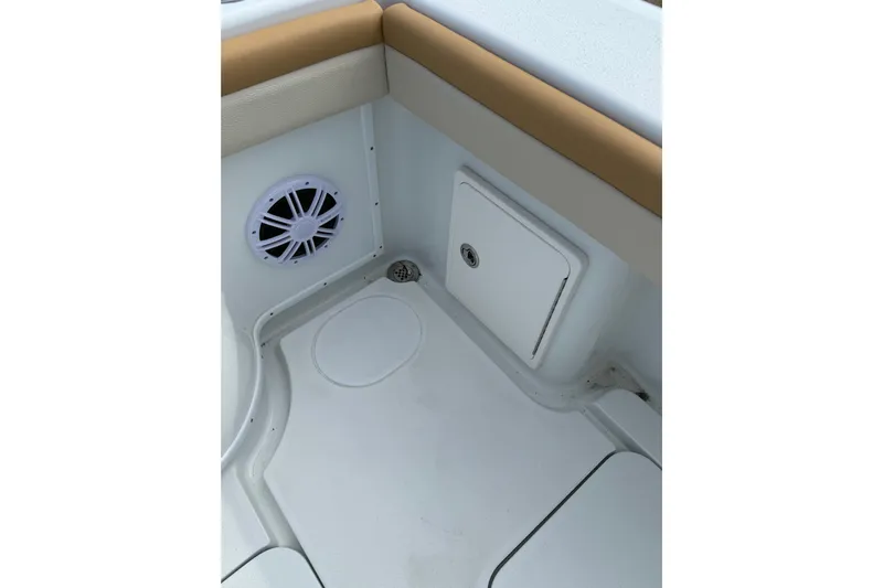  Yacht Photos Pics 2018 Yellowfin 32 Offshore boat interior with speaker and storage compartment.