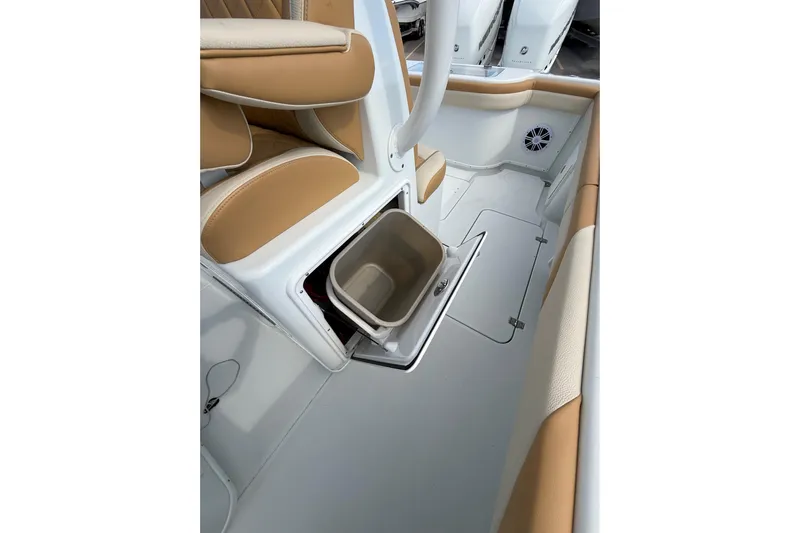  Yacht Photos Pics 2018 Yellowfin 32 Offshore boat interior with tan seating and storage compartment.