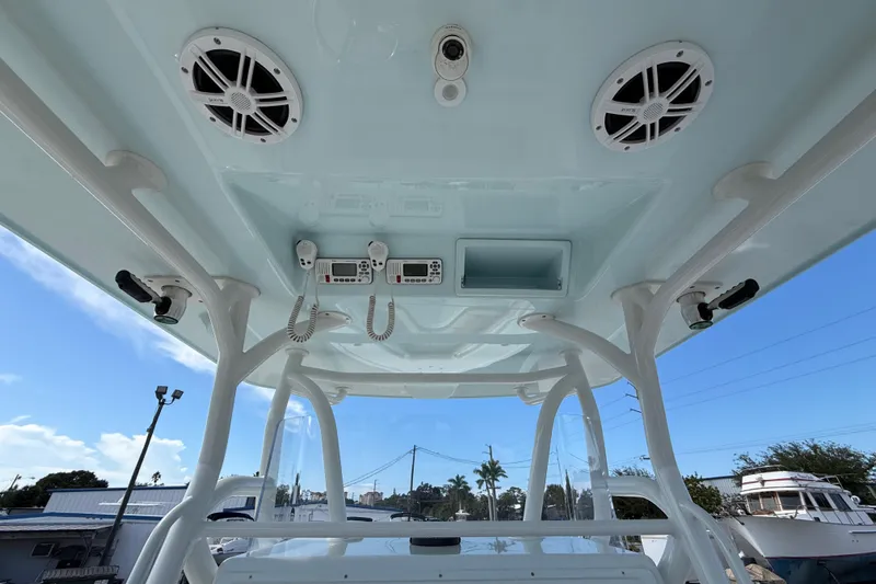  Yacht Photos Pics 2018 Yellowfin 32 Offshore boat console with speakers and communication devices.