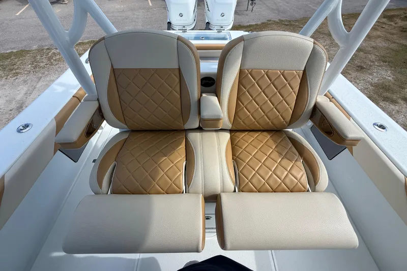  Yacht Photos Pics 2018 Yellowfin 32 Offshore boat seats with tan diamond-pattern upholstery.