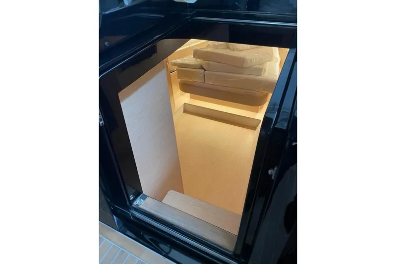  Yacht Photos Pics Interior view of 2024 Solaris Power 44 yacht, showcasing modern design and cozy seating area.