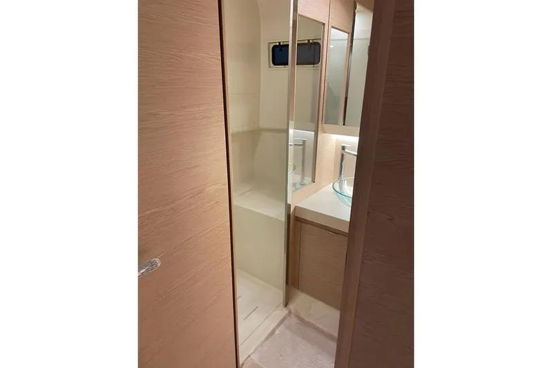  Yacht Photos Pics Luxurious bathroom interior of 2024 Solaris Power 44 yacht, featuring modern design and elegant finishes.