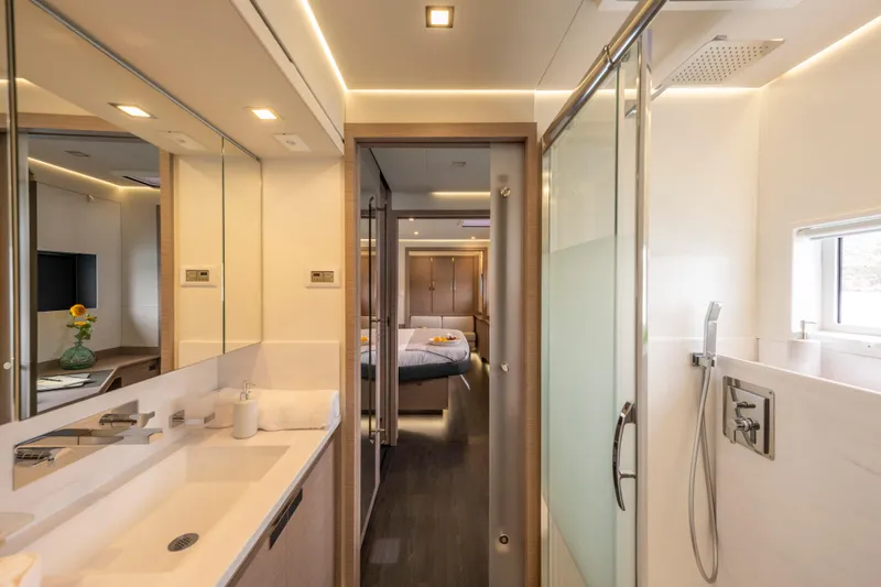 Semper Fidelis Yacht Photos Pics Luxurious bathroom interior of 2022 Fountaine Pajot Alegria 67 yacht, featuring modern design.