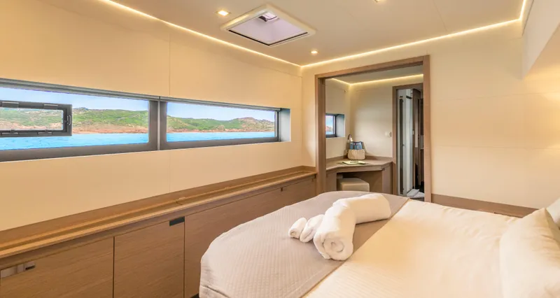Semper Fidelis Yacht Photos Pics Luxurious cabin interior of 2022 Fountaine Pajot Alegria 67 yacht with scenic ocean view.