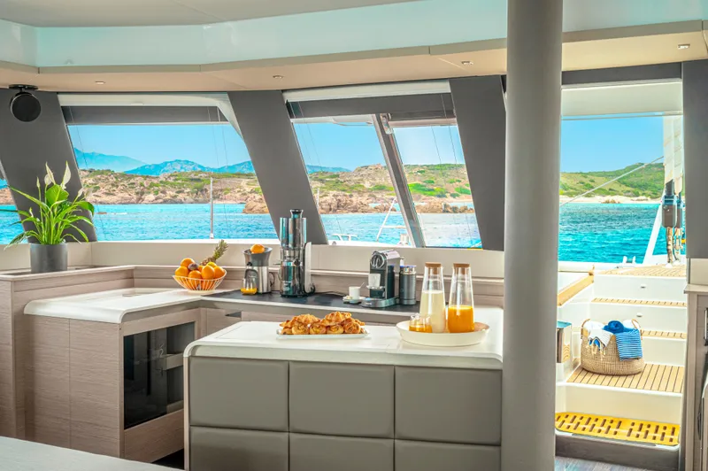 Semper Fidelis Yacht Photos Pics Luxurious interior of 2022 Fountaine Pajot Alegria 67 yacht with ocean view.