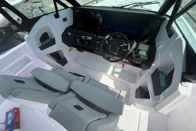  Yacht Photos Pics 2025 Axopar 29 Sun Top boat interior with modern dashboard and dual seating.