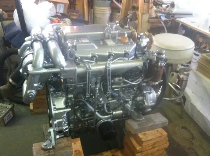 Vitesse Yacht Photos Pics Lagoon 55 1989 engine in a workshop, mounted on wooden blocks.