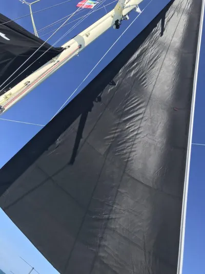 Vitesse Yacht Photos Pics Close-up of the sail and mast of a 1989 Lagoon 55 yacht.