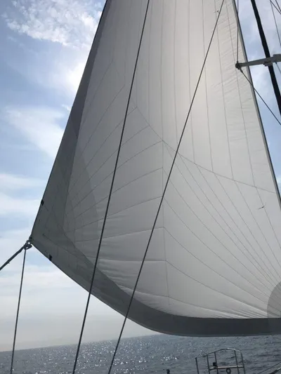 Vitesse Yacht Photos Pics Sailing yacht Lagoon 55 (1989) with full sails on a sunny day.