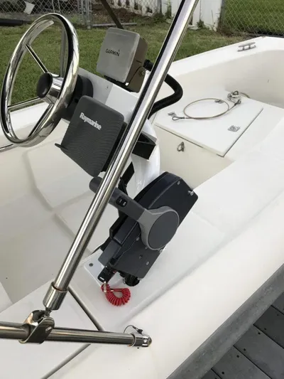 Vitesse Yacht Photos Pics Steering console of a 1989 Lagoon 55 boat with Garmin and Raymarine equipment.