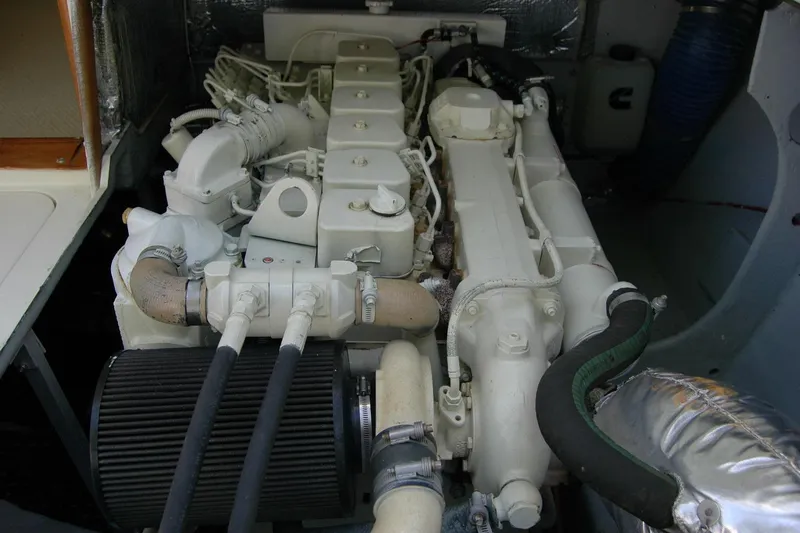 Vesper Yacht Photos Pics Engine compartment of a 1987 Bertram 33 Sport Fisherman boat, showcasing detailed components.